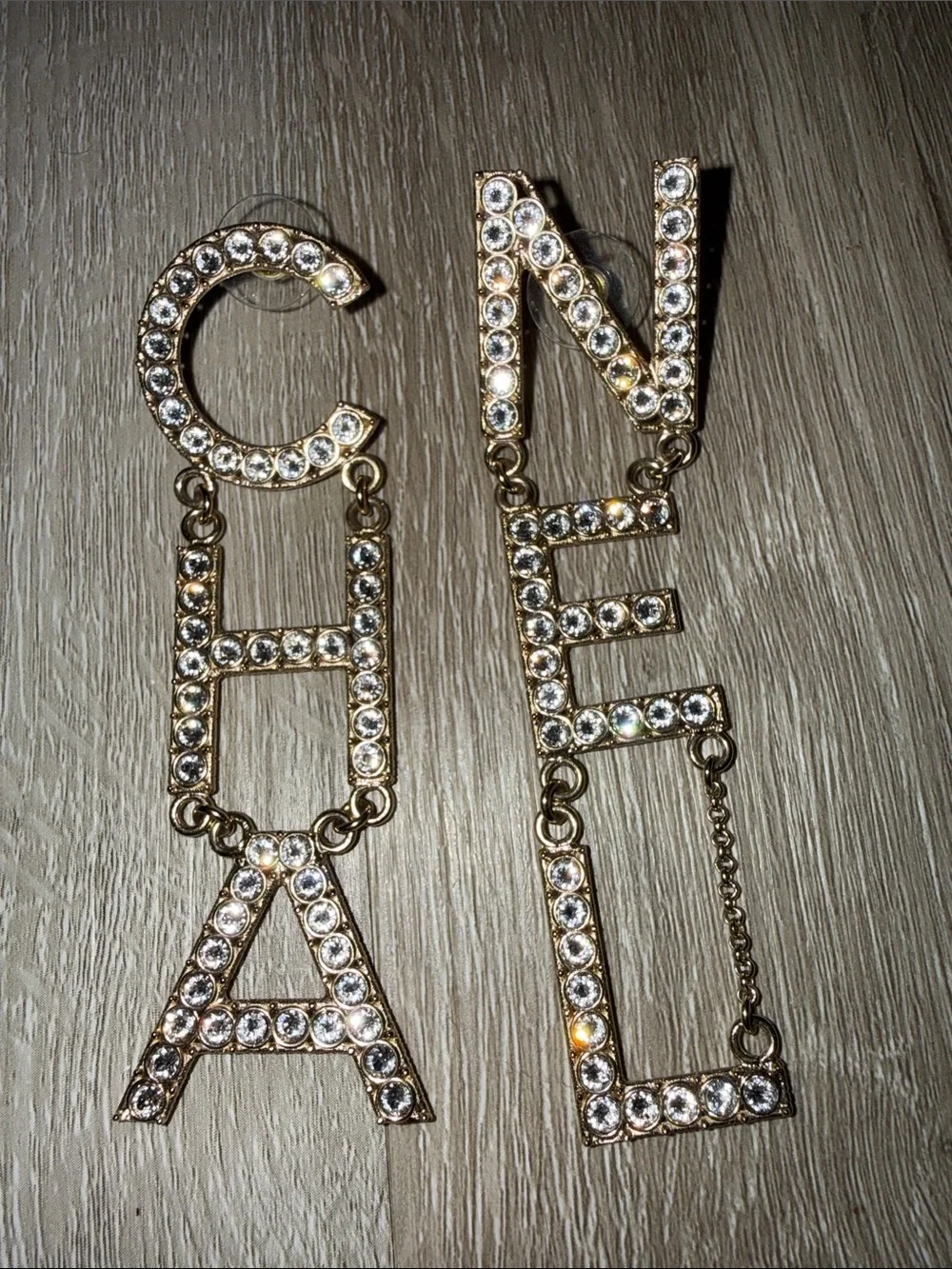 CHANEL Gold Crystal Logo Dangle Earrings
